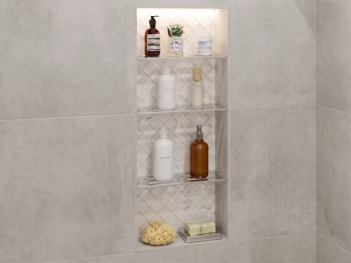 Multi-shelf layout showing a four rb3 Shower Niche Shelves installed into a larger niche.