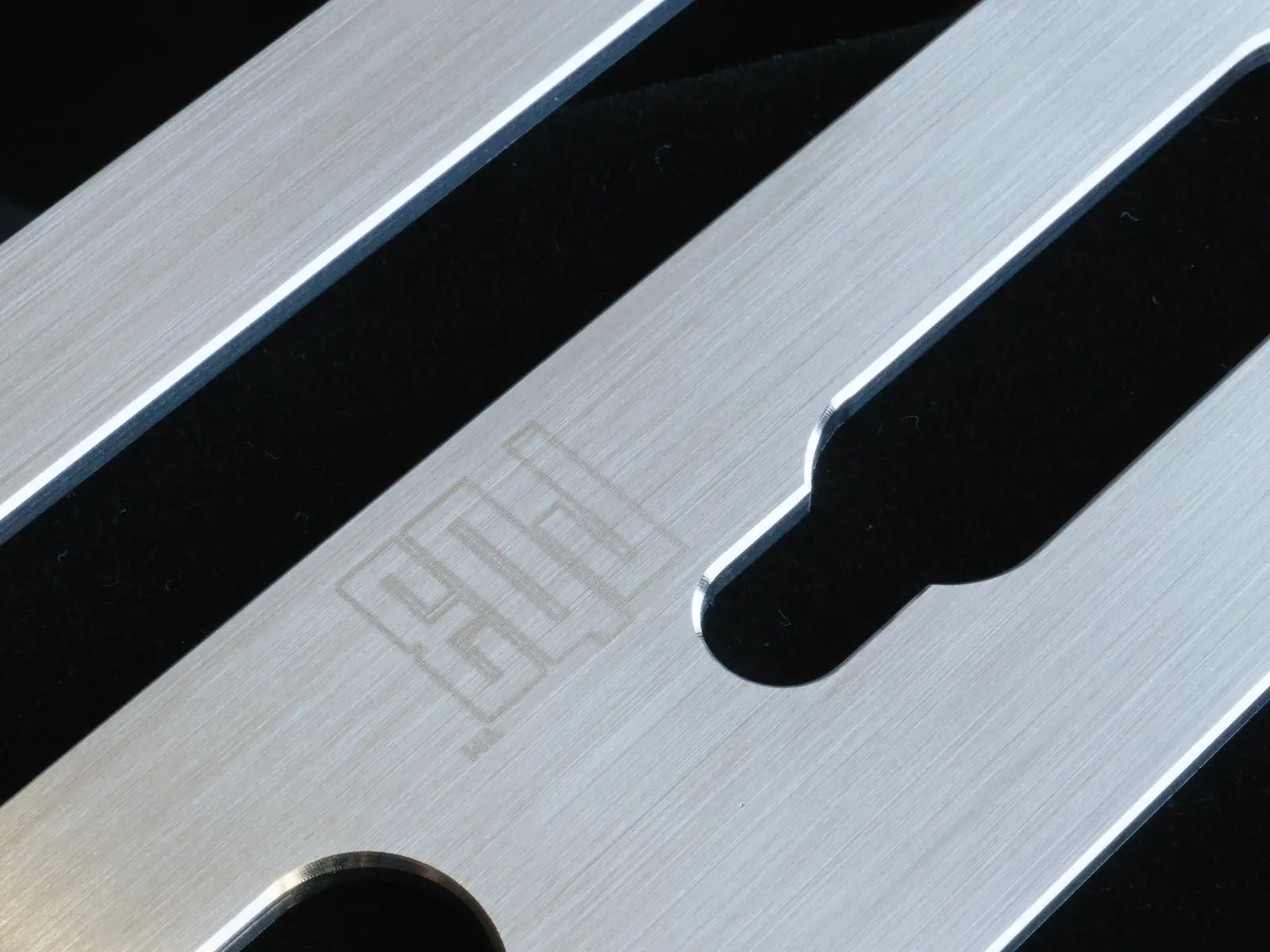 Close-up of the CNC-cut drainage and hanging slots in the Redblock Rb3m shower niche shelf
