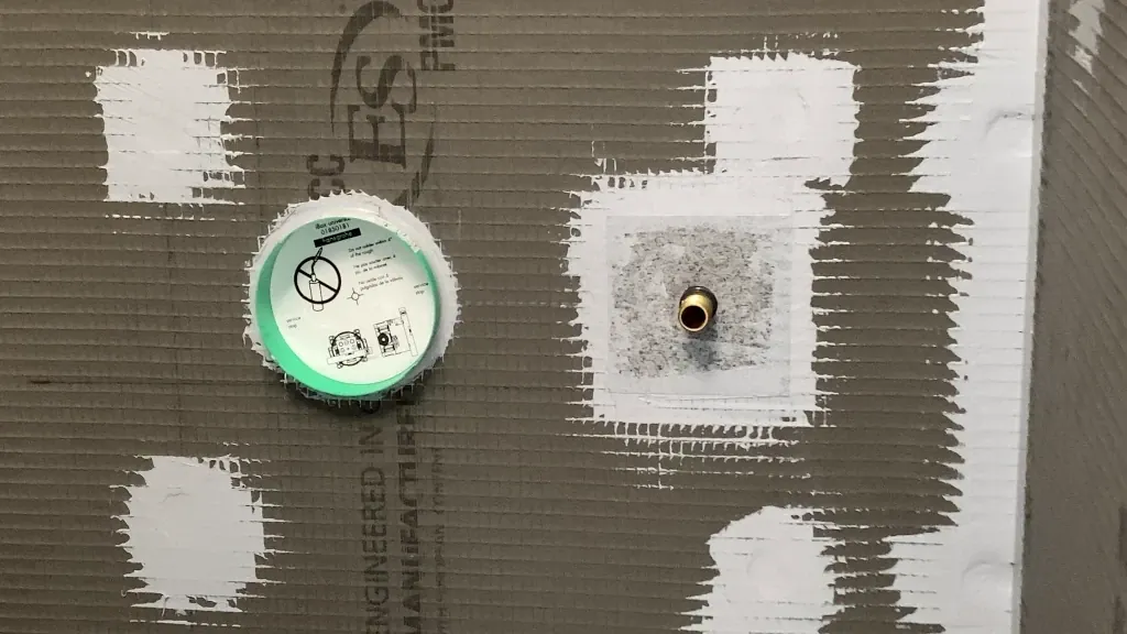 Waterproofing around valve housing and hand shower nipple