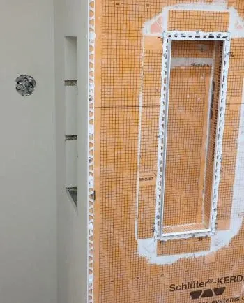 Tub-shower tile trim install on Kerdi-Beta job - how to build a shower niche post