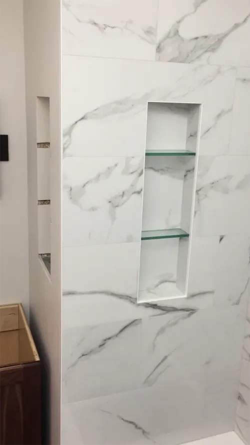 vlcsnap-finished tiled shower niche with glass shelves - shower niche height post