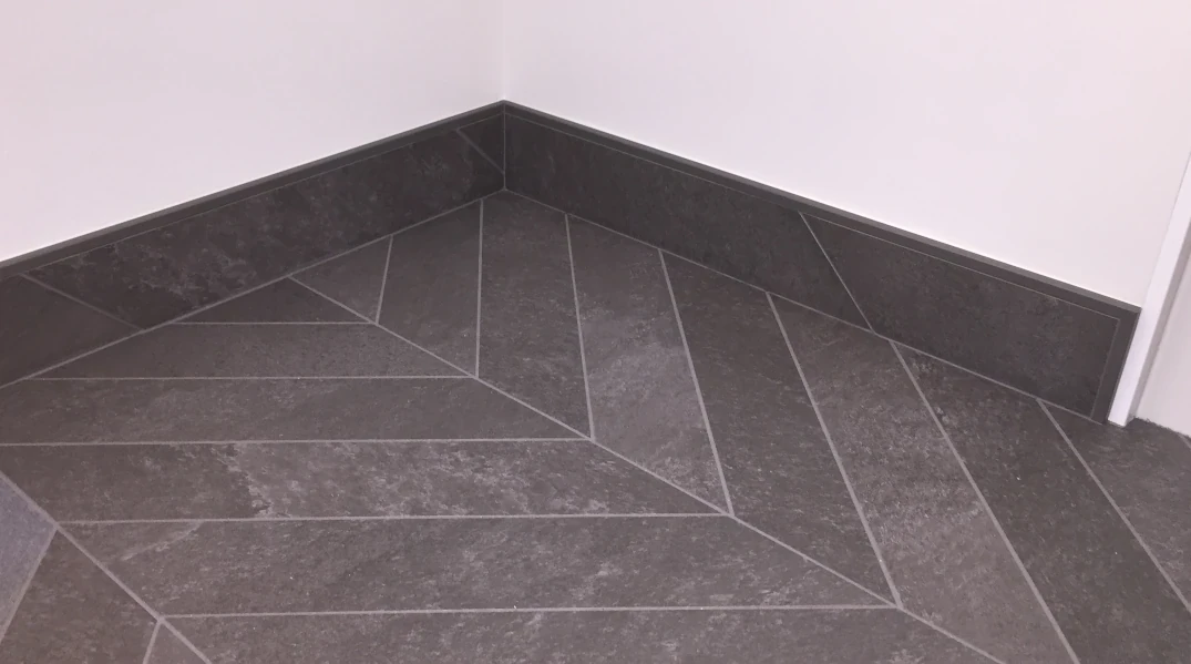 Quadec square edge trim Beta's bathroom floor-2018 - tile edge trim post
