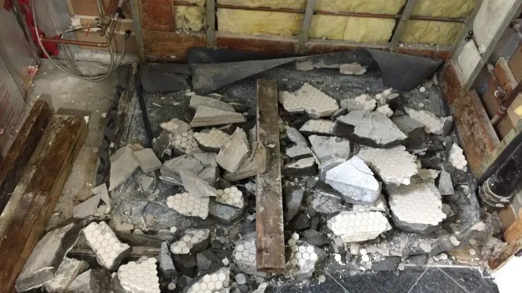 Demo'd shower base with rubber liner - waterproofing shower walls post
