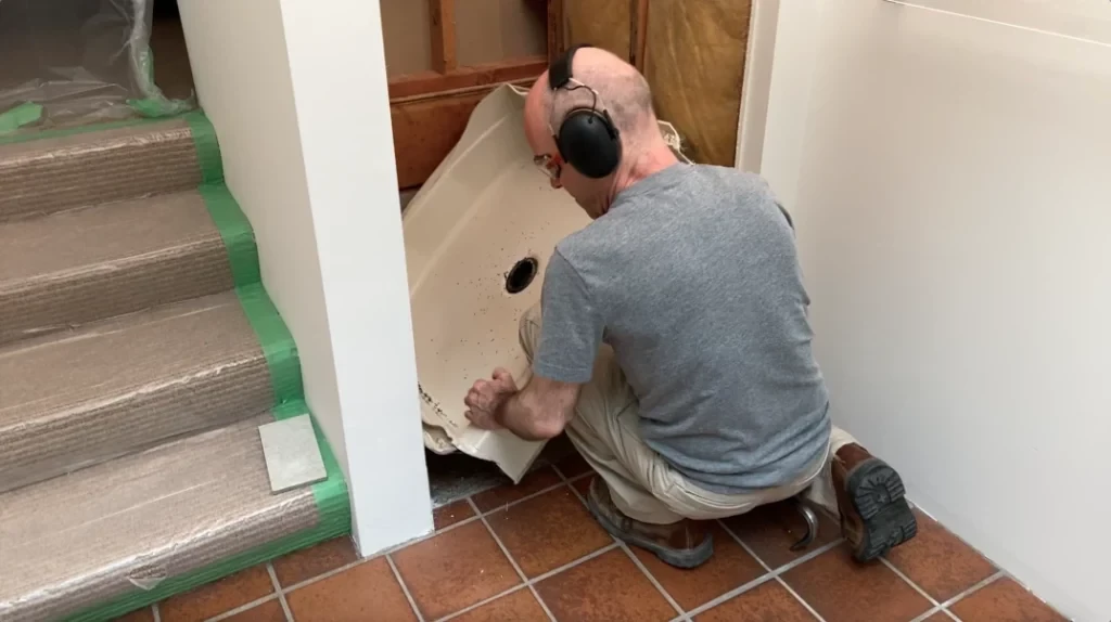 Removing acrylic shower pan - removing tile from a bathroom wall post