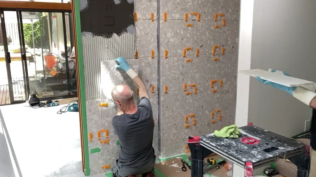 Installing shower wall tile on left side of niche