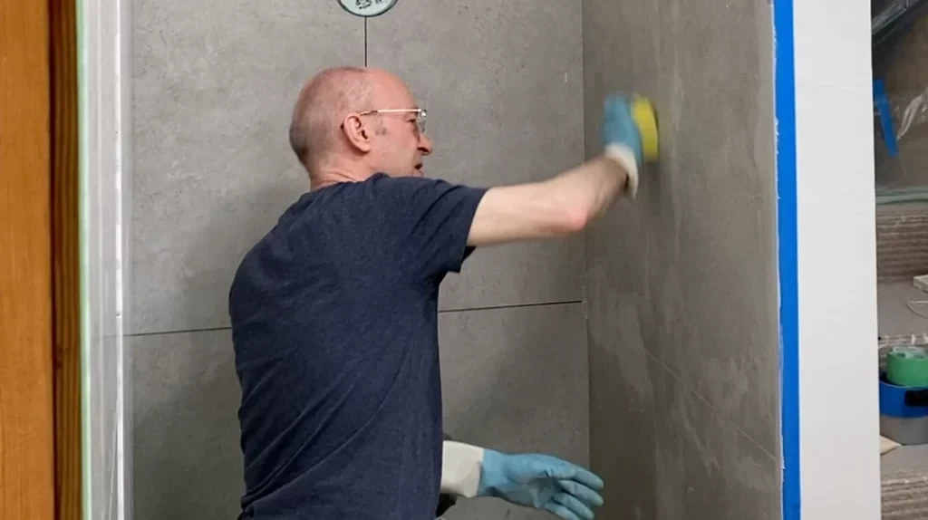 Sponging grout off pony wall -Lay shower tile post