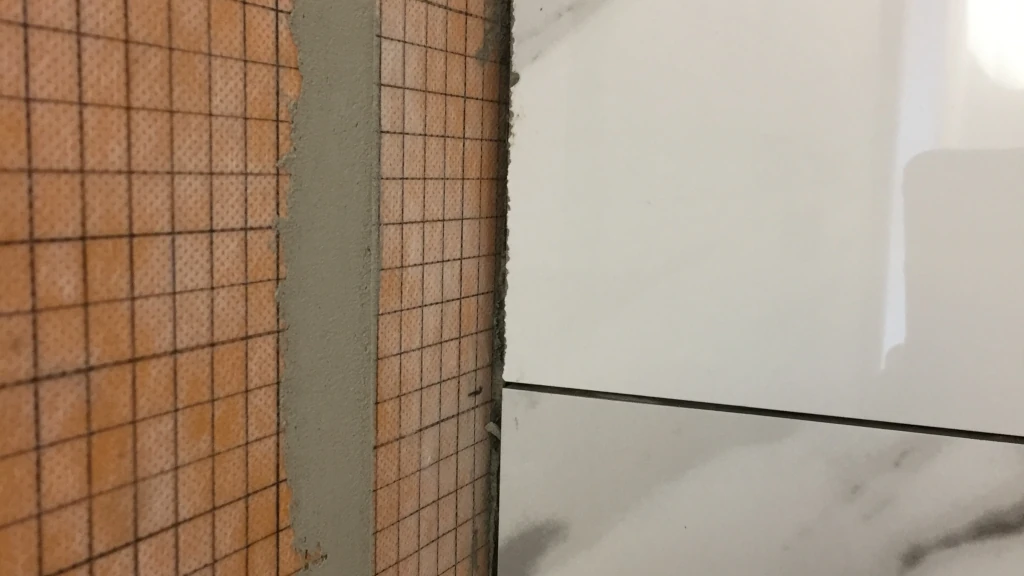 Rough cuts on back wall tile end cuts are OK