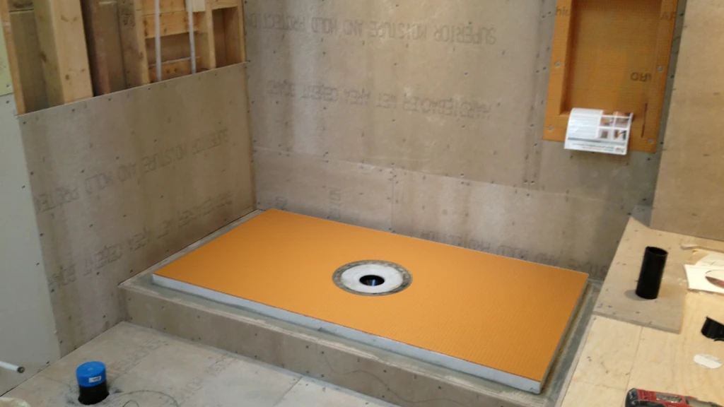 Bonded flange drain integrated with Kerdi foam shower tray in shower floor