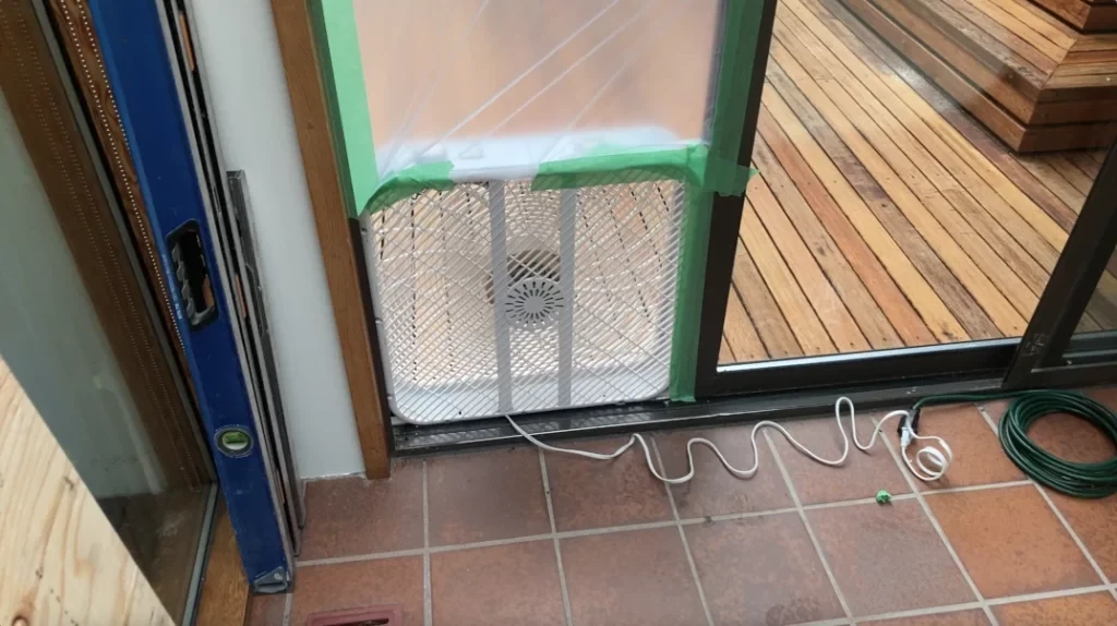 Fan in door opening - removing tile from a bathroom wall post