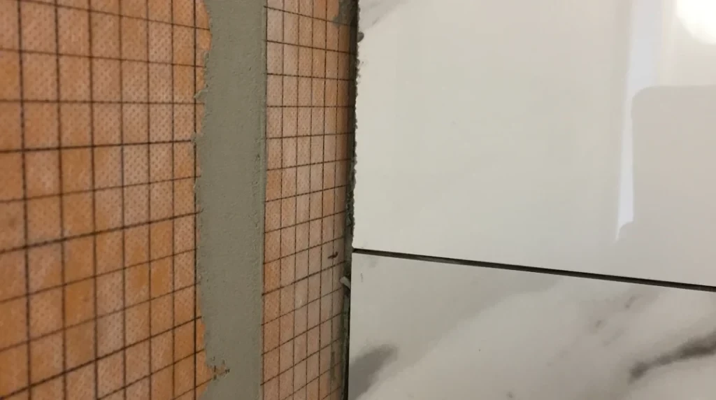 Back wall tle edge cuts -Lay shower tile post