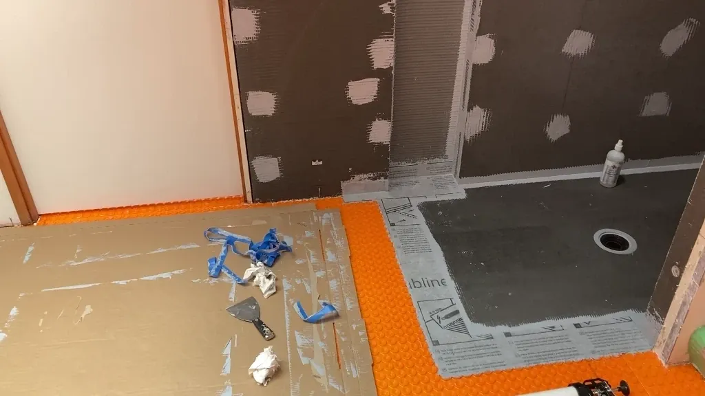 Installing Subliner strip across pan-floor margin