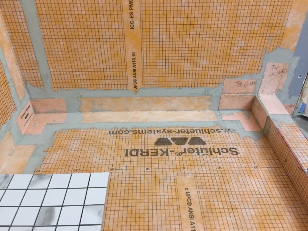 Kerdi installed into shower corners - Lay shower tile post
