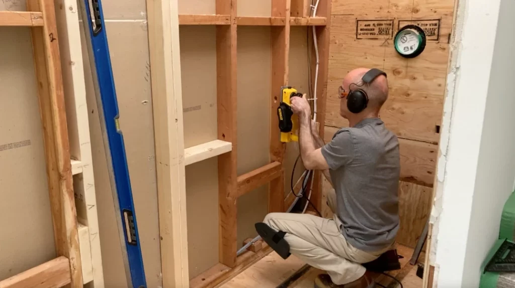 Planing edges of studs - Lay shower tile post