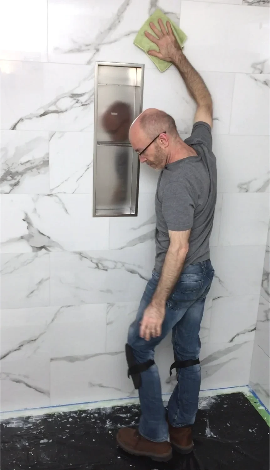 Redblock owner Steve finishing a past shower remodel project