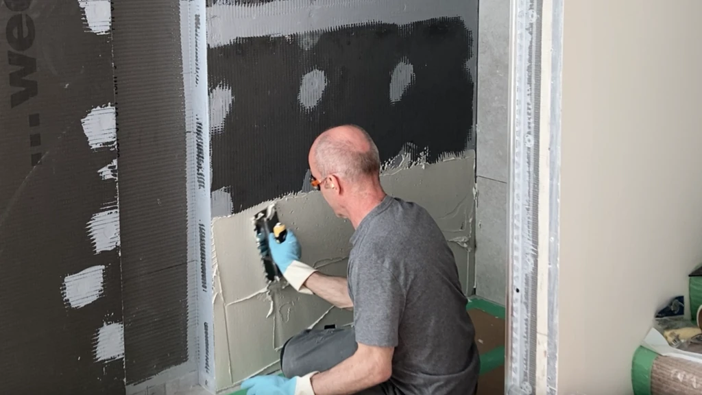 spreading the correct amount of thinset for half-inch notched trowel