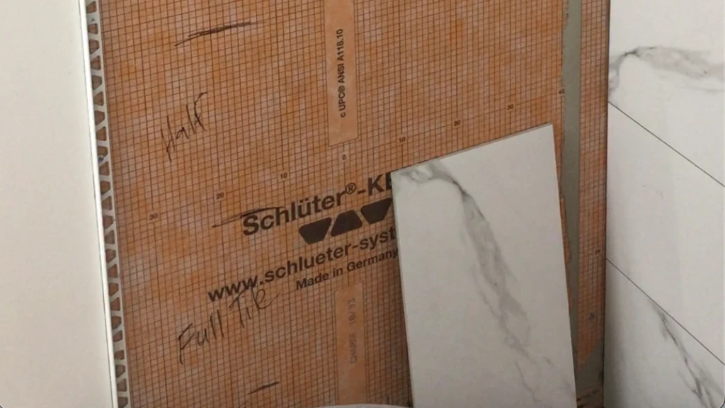 Installing tile trim before setting side wall tile