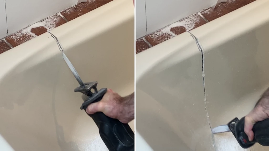 Cutting out old acrylic bathtub with reciprocating saw