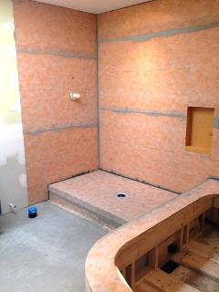 Raised shower with pebble base, Schluter kerdi and niche - in progress