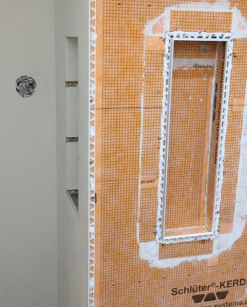 Tub-shower tile trim install on Kerdi-Beta job