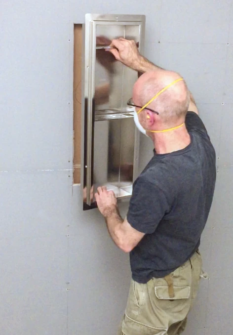 Steve installing a Redblock Shower Niche